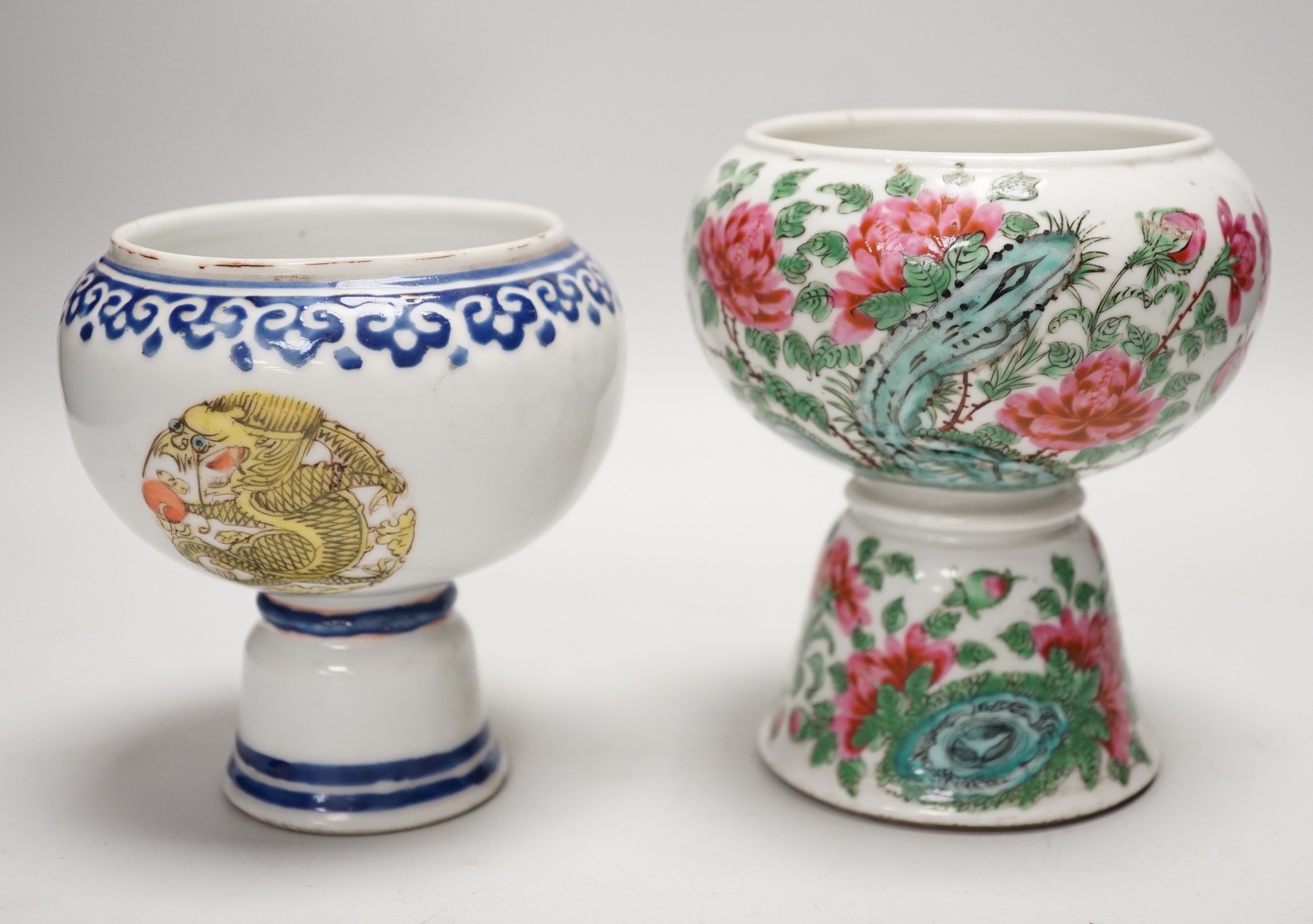 Two 19th century Chinese porcelain stem cups, The first decorated with Dragon medallions, the second with peonies and rock work, tallest 13.5cm